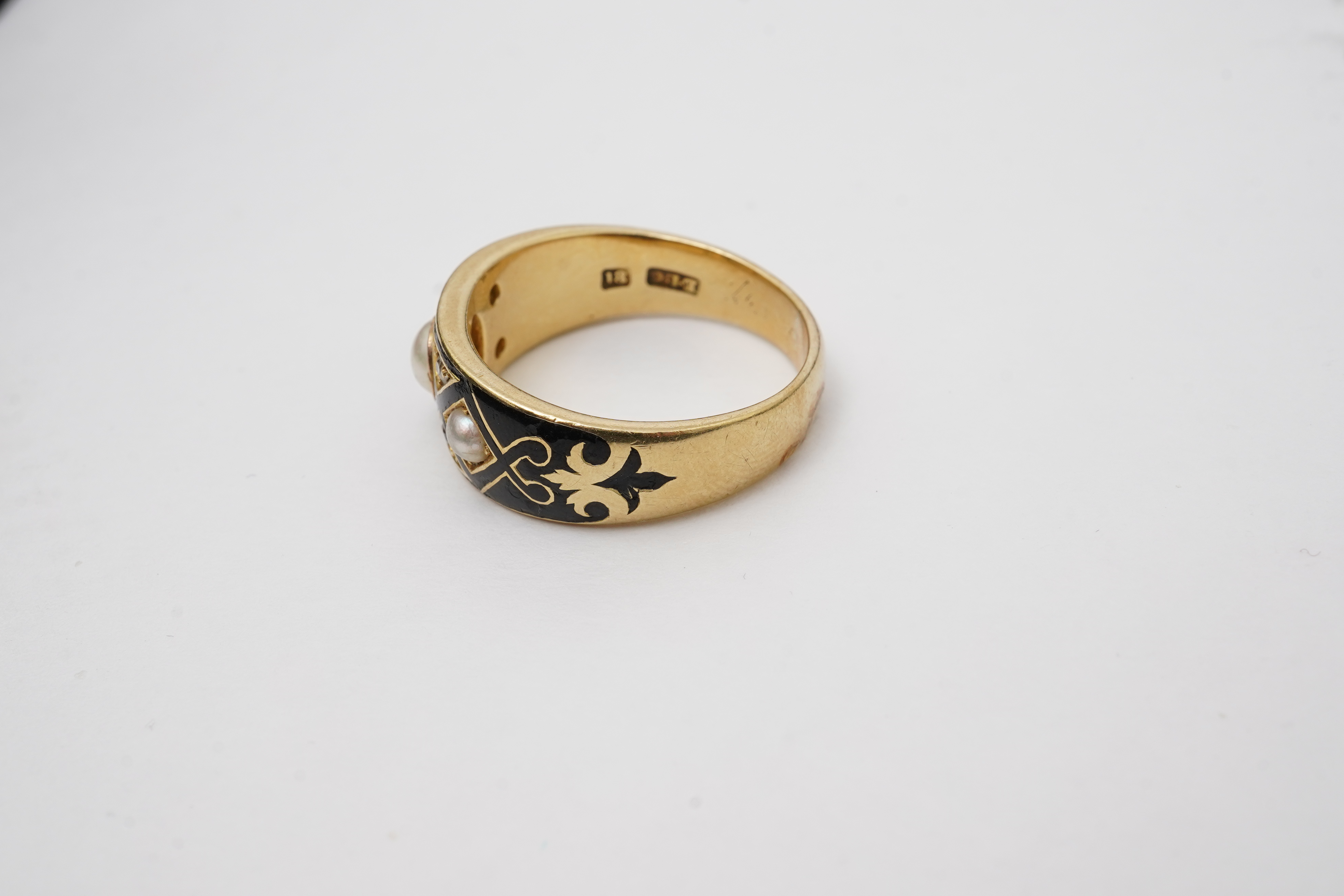 A Victorian pearl, enamel and diamond mourning ring, late 19th century